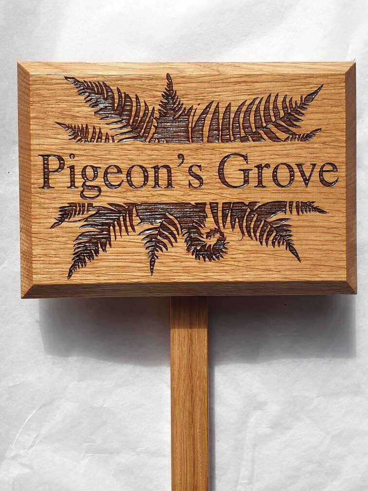 Personalised engraved garden sign with ground stake attached.  Made from solid oak Text and images can be added.