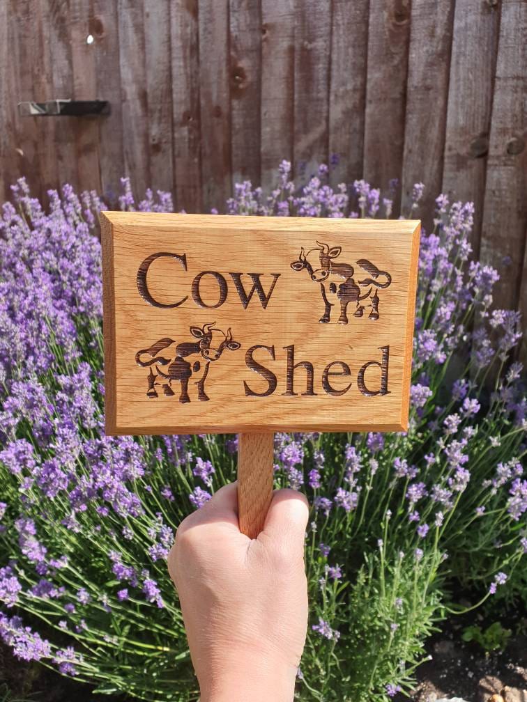 Personalised engraved garden sign with ground stake attached.  Made from solid oak Text and images can be added.
