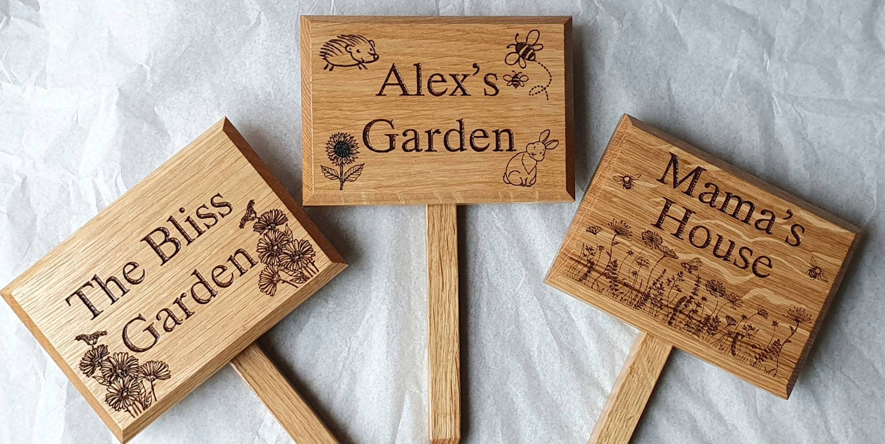 Personalised engraved garden sign with ground stake attached.  Made from solid oak Text and images can be added.