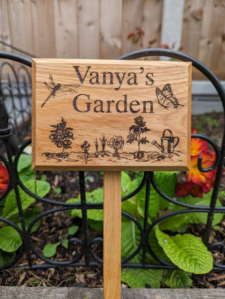 Personalised engraved garden sign with ground stake attached.  Made from solid oak Text and images can be added.